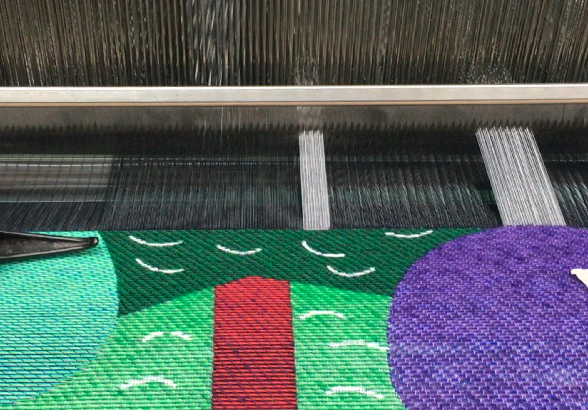 Detail of woven wall hanging being woven