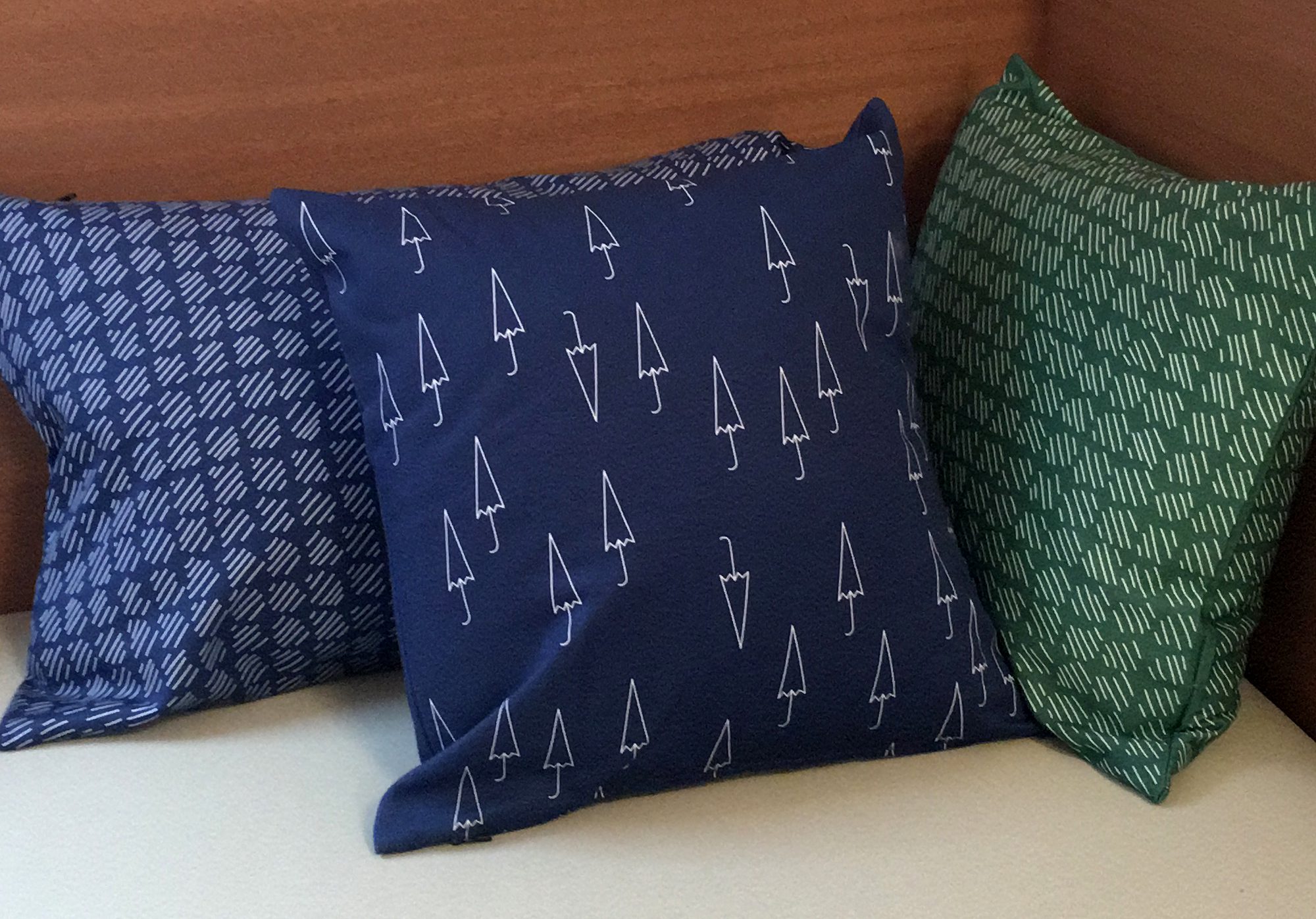 Three printed cushions